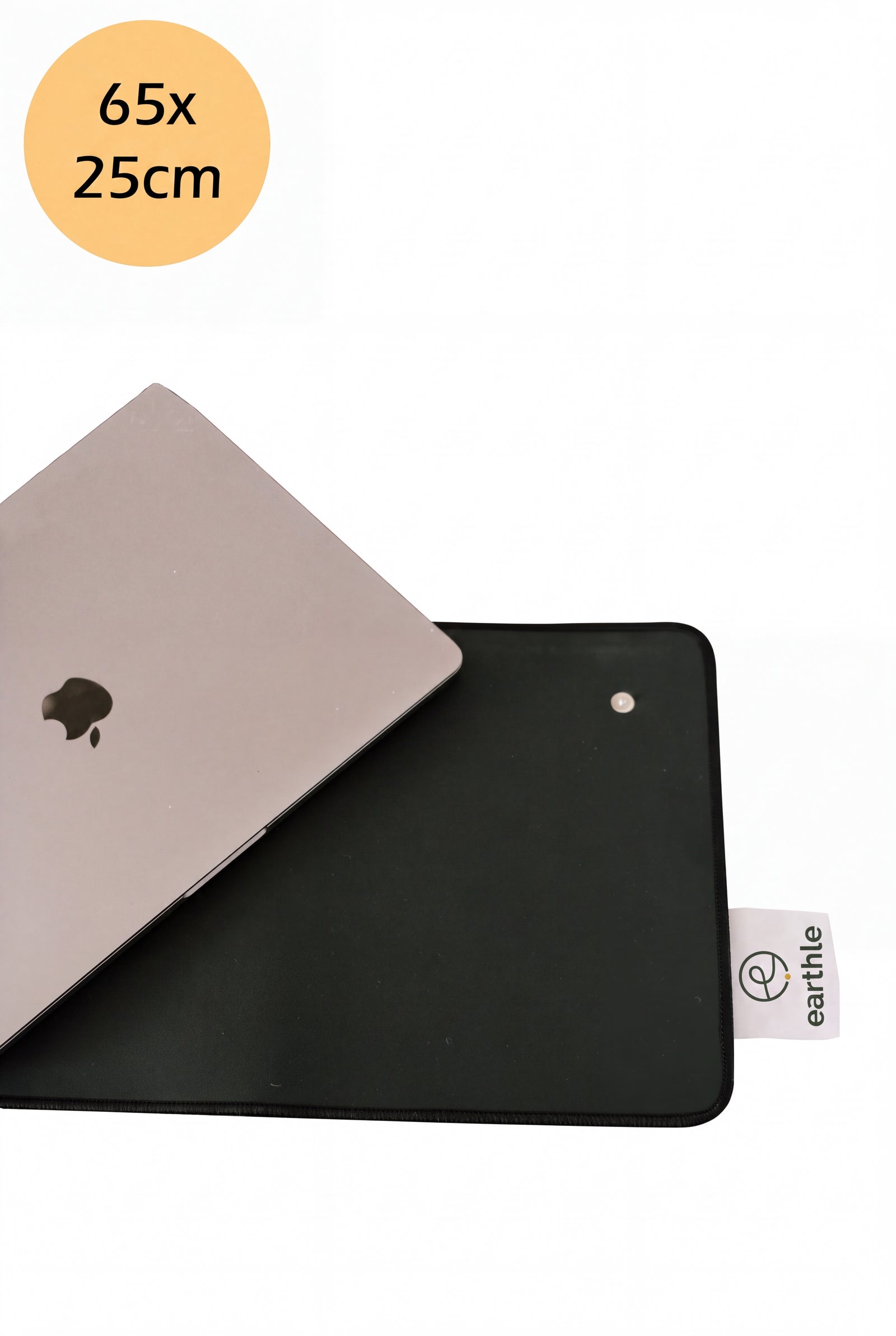 Earthle earthing desk mat in vegan leather with a laptop on top, 65 x 25 cm