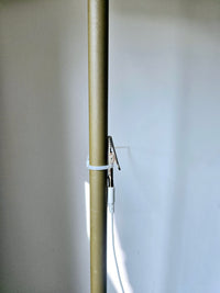 Earthle earthing cable running along a heating pipe, fixed with the supplied clamp