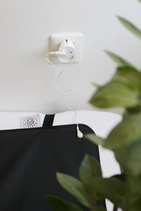 Earthle earthing plug in an earthed socket, with the cable running to the sleeping mat