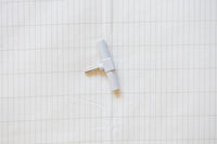 Earthle earthing splitter on the earthing sheet, with the silver grid in the fabric around it