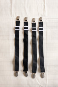 The four Earthle sheet straps side by side, with the clips at both ends